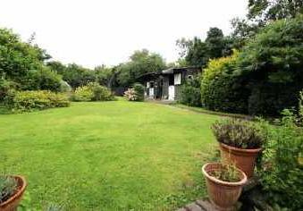 To the rear of the property is an extensive expanse of garden with side established borders and planted beds. Central Heating Oil fired central heating system. Tenure Freehold.