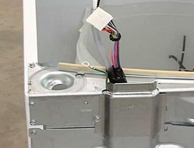 Another solution is to lay the washing machine on its back and pull the outer tub and suspension rods from the bottom of the cabinet.