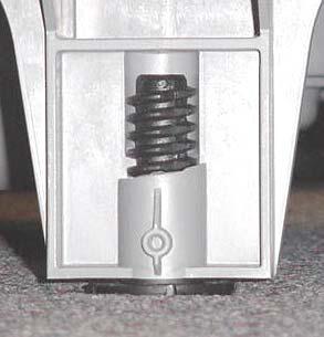 Factory feet positions, like the center rear foot (1), have provisions for set screws (below right).