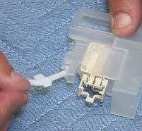 7. Carefully pull the float lever from the housing