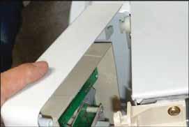 Lift the panel to disengage from top and bottom tabs that hold the right of the panel in place. 5.