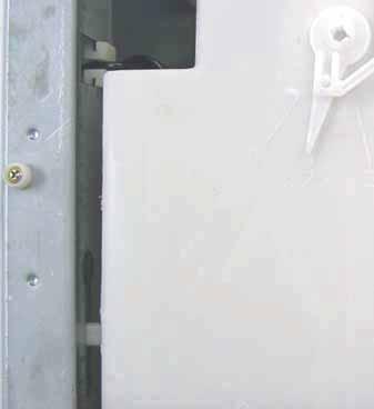 ) NOTE: Ensure the dispenser guide pin is inserted into the slot in the side of the cabinet left side top brace. Caution: Lock tabs on the dispenser motor wiring harnesses are fragile.