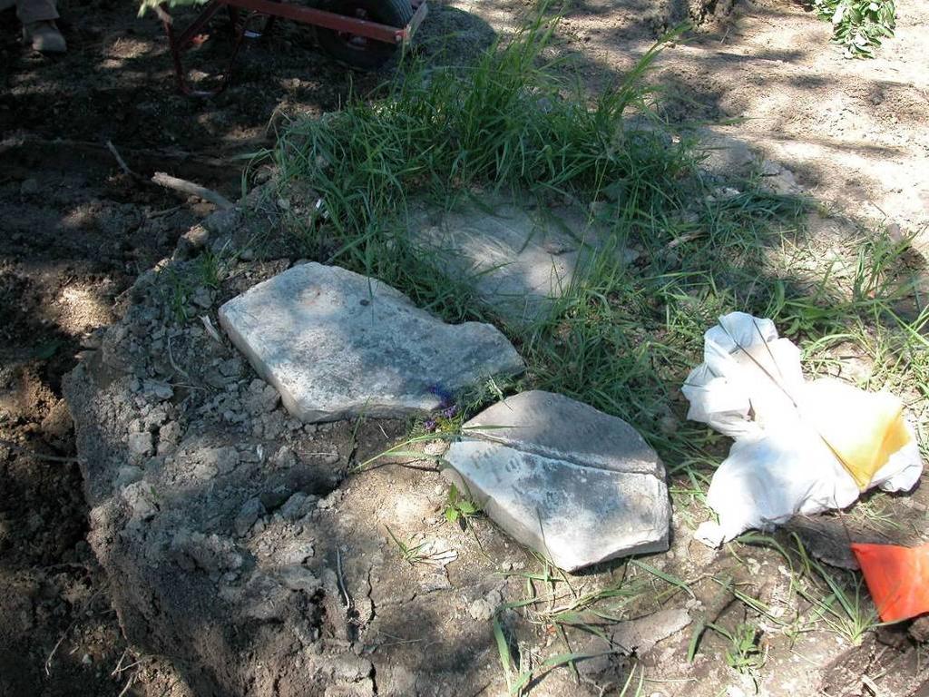 (Michael Harrison) Figure 10: Photos showing the infant grave marker in situ