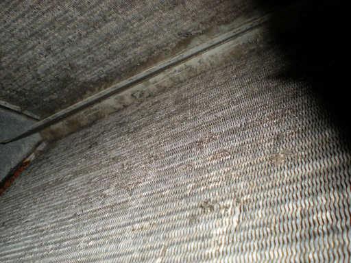 AIR CONDITIONING: The coils in the upstairs air handler were somewhat dirty and rusted.