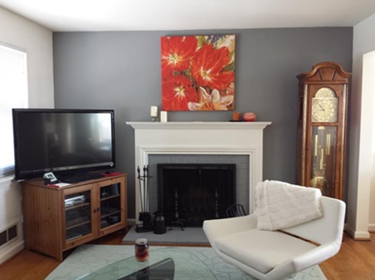 shelves on the fireplace wall that displays hand-crafted ceramic art pieces and paintings that our clients made are