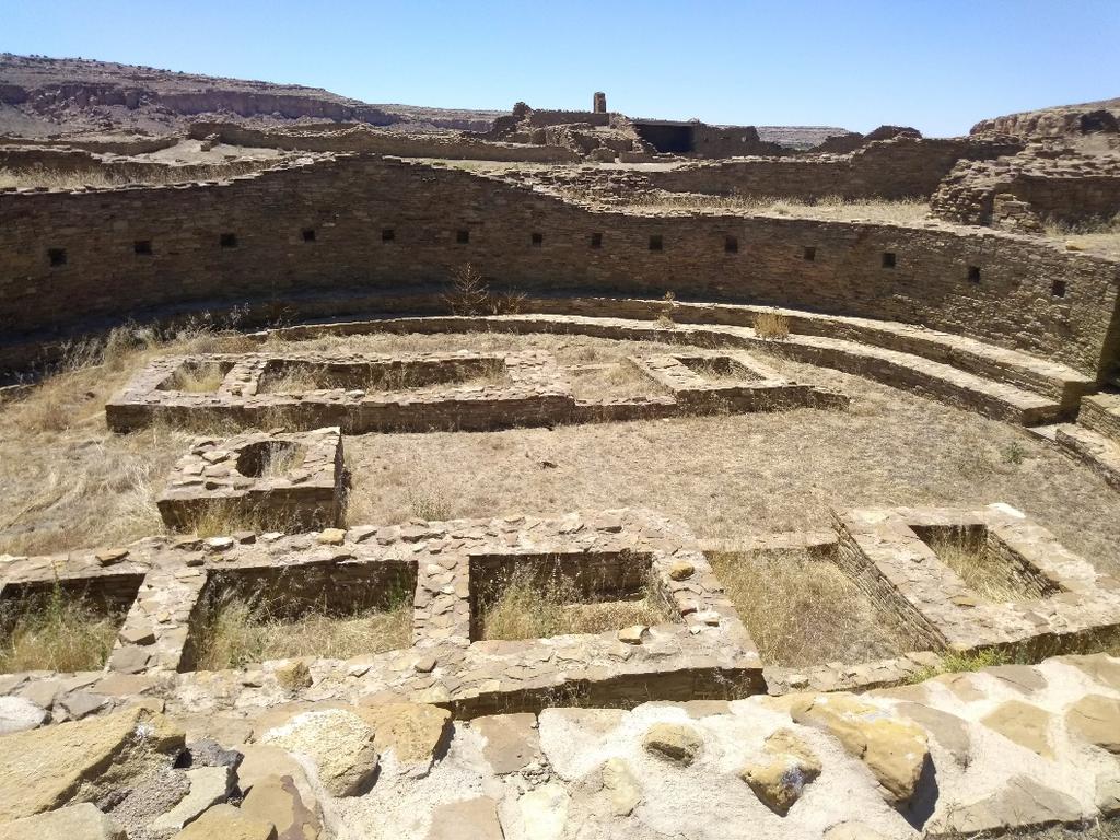 A photo of a great kiva at Pueblo Bonito in Chaco Canyon. During its use, the top would be covered with a wooden roof and people would have sat at the benches along the outer edge during ceremony.