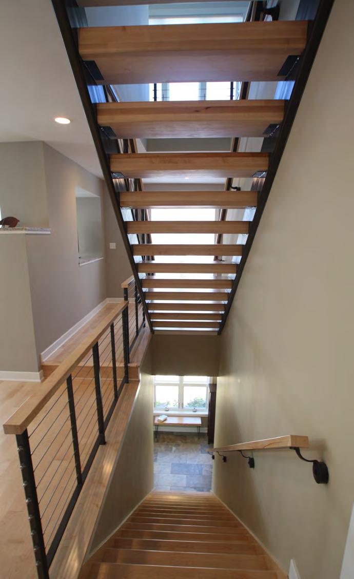 Design: The homeowner challenged our team to design a unique staircase that would be artful
