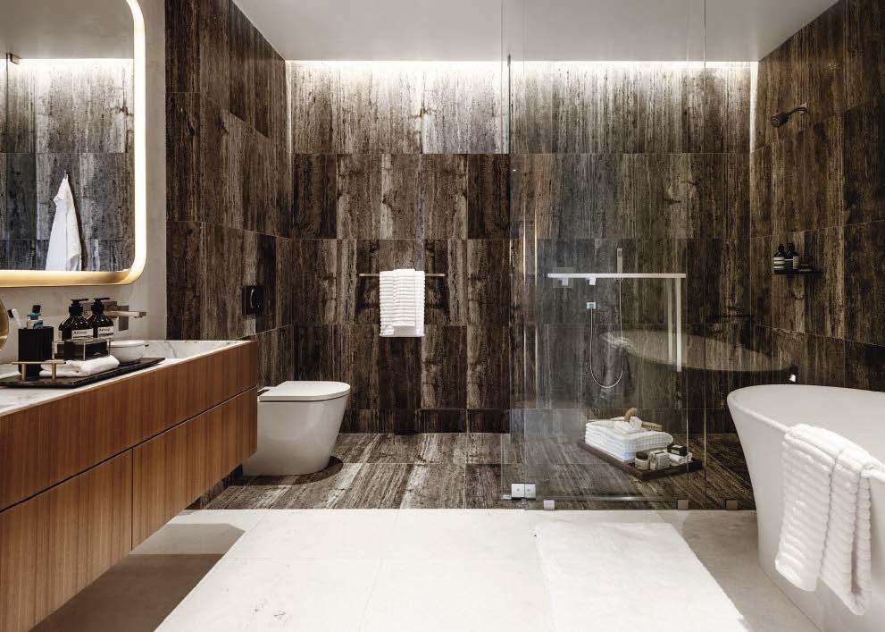 BELOW: in the bathroom the walls and floors are covered in titanium travertine and French vanilla marble.