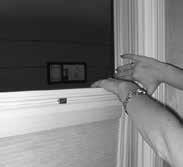 ) Next, slide down the upper sash until you can reach the upper sash releases located on the top of the sash.