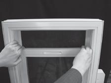 Slide the edge of the sash toward the center of the window opening. The sill hinges will lock in place and position the sash for washing. 4.