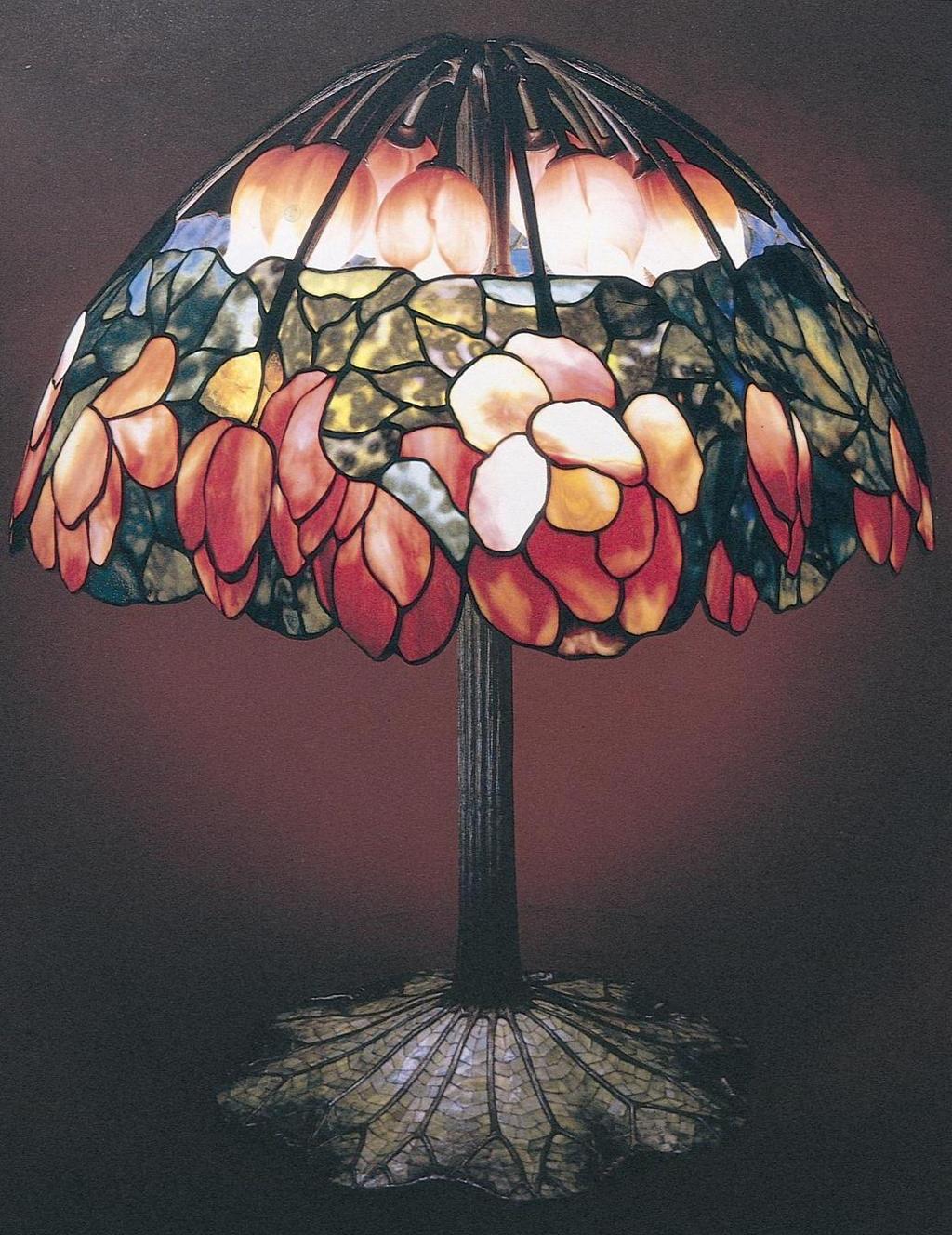 Louis Comfort Tiffany Lotus table lamp (1905-1910) Tiffany was an American artist and designer well known for his large stained glass windows and his handcrafted lamps.