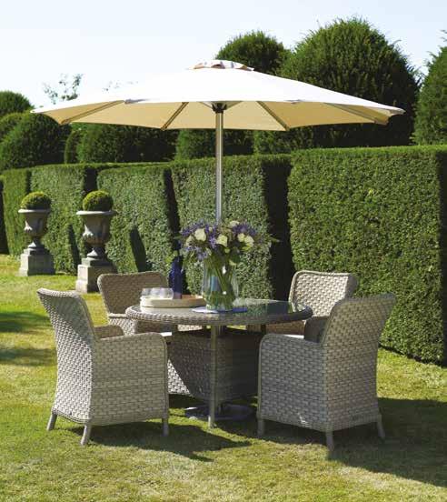 Canterbury Dining Set Maintenance-free wicker in a willow shade. Season-proof, fawn cushions with removable covers.