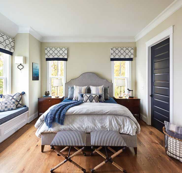 Nightstands from Woodbridge Furniture flank either side of the Wesley Hall custom-upholstered bed, and distinctive accessories from Uttermost add a touch of extra panache.