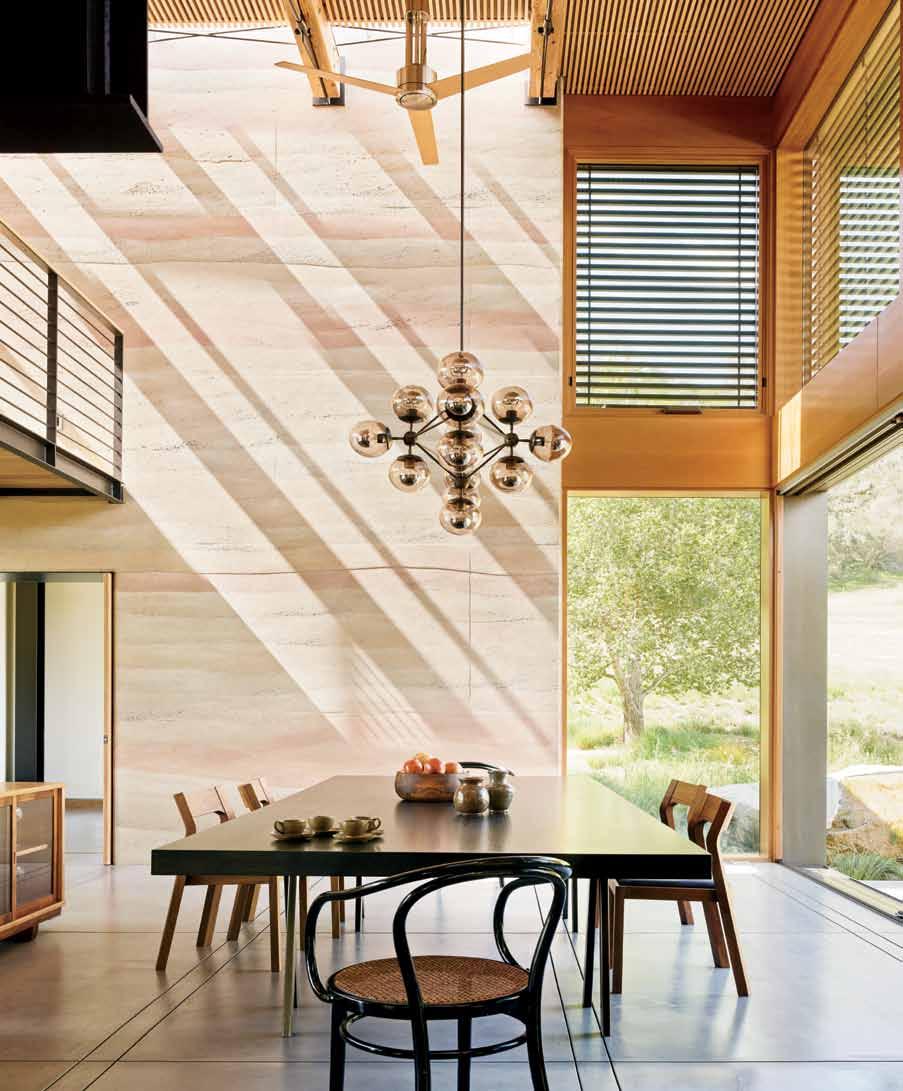 Left: Because there is a change of grade from one side of the house to the other, the architect elevated the dining area two steps above the living room.