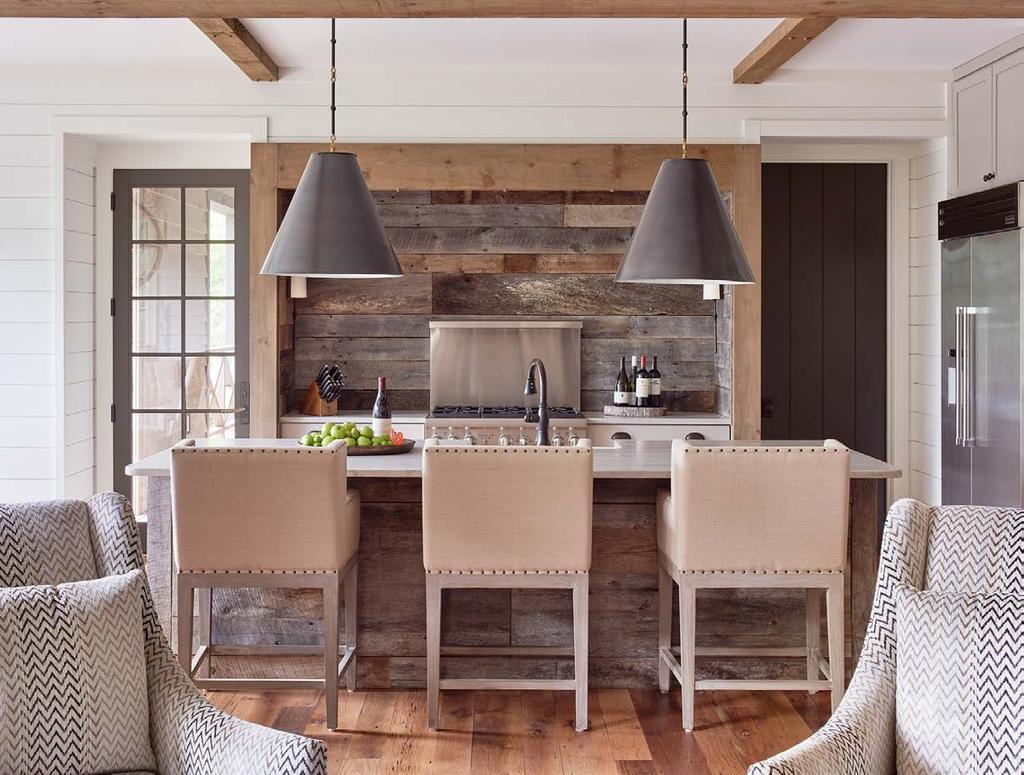 The kitchen is a unique marriage of reclaimed barn wood paneling and exquisite Marmara marble. The unexpected combination is strikingly beautiful and ignites a balance of elegance and calm.