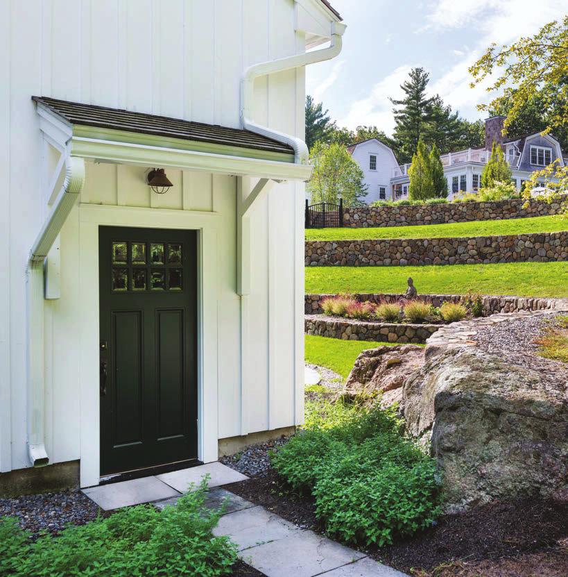 THIS PAGE, FROM TOP The barn s board-andbatten exterior helps it ﬁt in with the rest of the estate, while traditional doors and light ﬁxtures lend it a historical air.