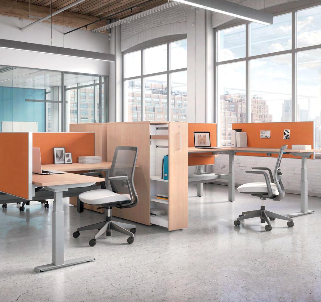 (Left) FreeFit table shown in Designer White (DWT) base with Clear Maple (CMB) top and table mounted glass divider. Factor (5541) task chair with Green (Q4) mesh and Terrace Apple (TC66) seat.