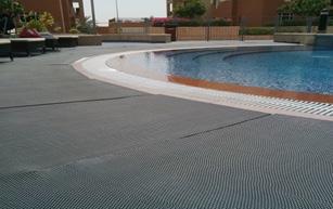 New, durable ceramic tiles have been fixed on the pool deck, replacing the old, damaged semiwooden deck.