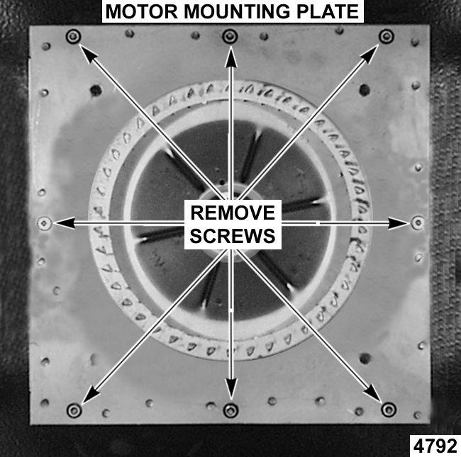Remove screws securing baffle panel and remove the panel. Fig. 22 5. Place a piece of cardboard on the bottom of the oven cavity to protect its surface from any damage during motor assembly removal.