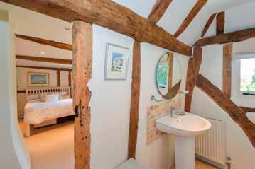 En suite Further Oil fired central heating Honey coloured oak beams Clearview wood burning stoves Gardens Pebble driveway Further parking Log