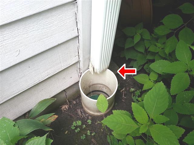 1.3 (2) The downspout is connected improperly (allowing water to run on outside) at the back left corner (from front). This is for your information. Repair as needed. 1.