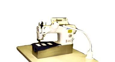Emblem Sewing Station A Single Needle Lockstitch with thread trimmers and electric foot lifter has been configured specially to speed emblem sewing.