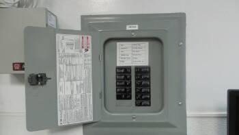 1. Electrical Panel Utilities Shop Materials: Service Entrance - Overhead Service Panel Amperage - 100 Amp Service Main disconnect at exterior meter Panel box located at wall Panel Manufacturer -