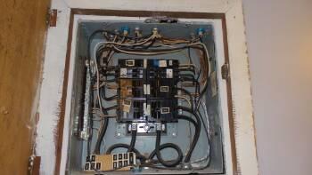 1. Electrical Panel Utilities Unit 6 Materials: Service Entrance - Overhead Service Panel Amperage - 100 Amp Service Main disconnect at exterior meter Panel box located in kitchen Panel Manufacturer