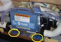 7. Remove the two shipping bolts located on the front of the pump mount (circled in illustration). 8.