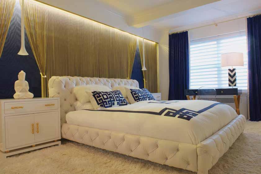 Lighting plays a significant role throughout the project. Here, the brass curtains behind the bed is illuminated with LED strips.
