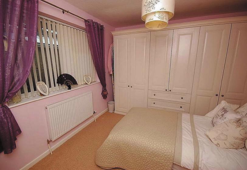 Bedroom COUNCIL TAX BAND: 3.61m x 3.02m max. inc robes (11'10" x 9'11" max. inc robes) Having fitted wardrobes and drawer units, central heating radiator and upvc double glazed window.
