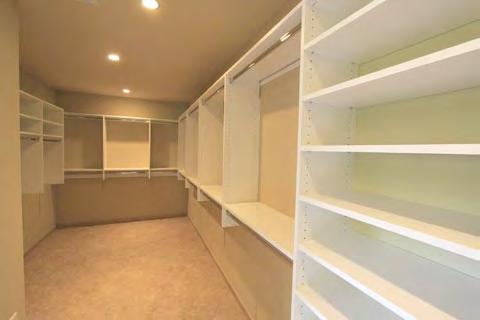 wall unit with open shelving, two custom built-in medicine cabinets with frosted