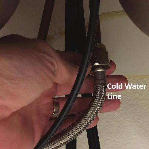 Open the main faucet to the cold position to drain the water from the line. 2.