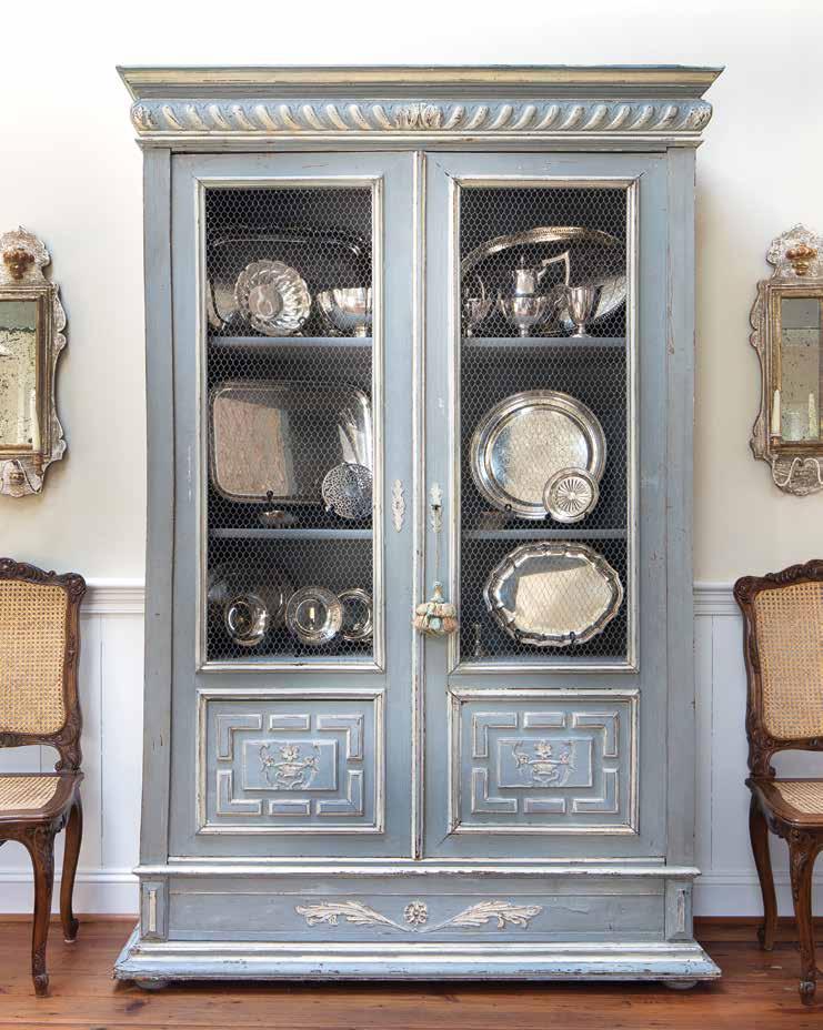 French accents such as this blue armoire, which displays Jane Goss