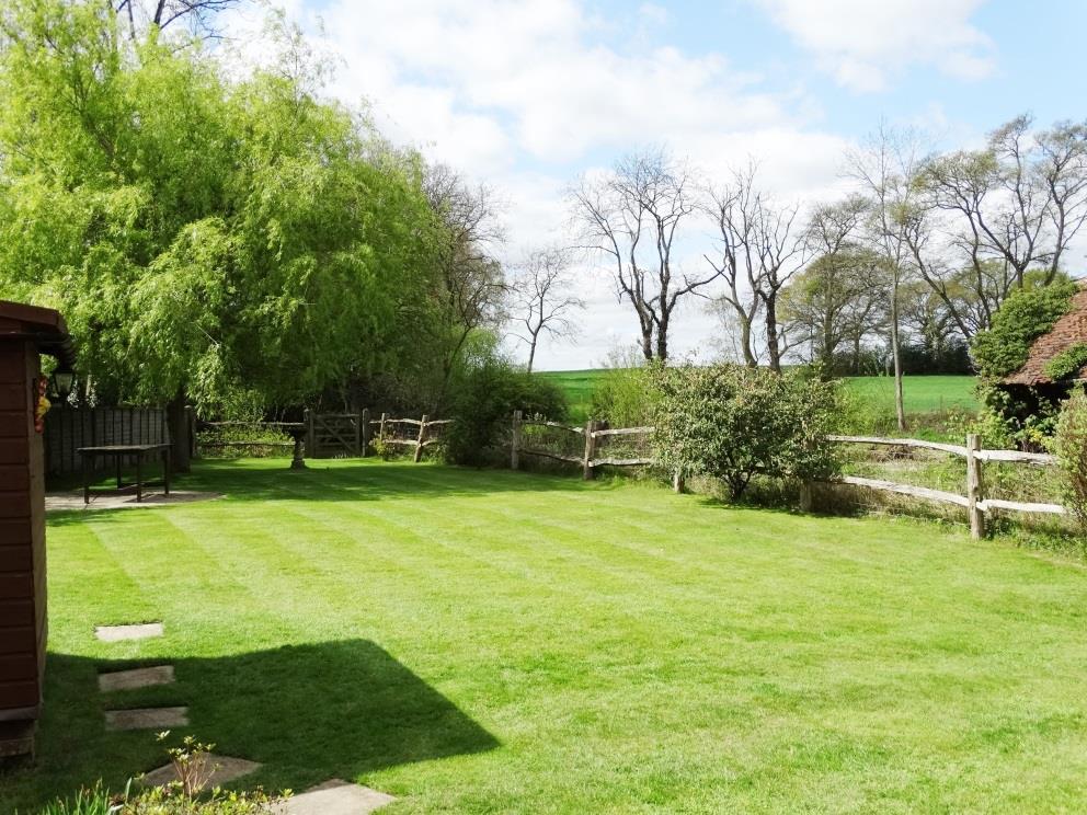 OUTSIDE As previously mentioned the property is set in approximately ⅓ of an acre and enjoys a beautiful lawn to the front with established, shrubs, bushes and hedges.