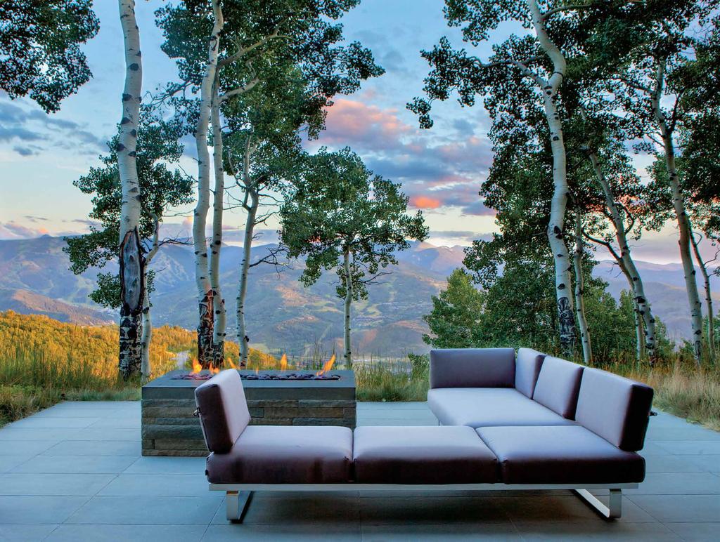 A Janus et Cie sectional appoints a terrace off the lower-level recreation room and offers a comfortable spot for enjoying the site s sweeping vistas.