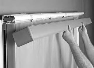 Rotate the valance down to snap it into place onto the headrail.