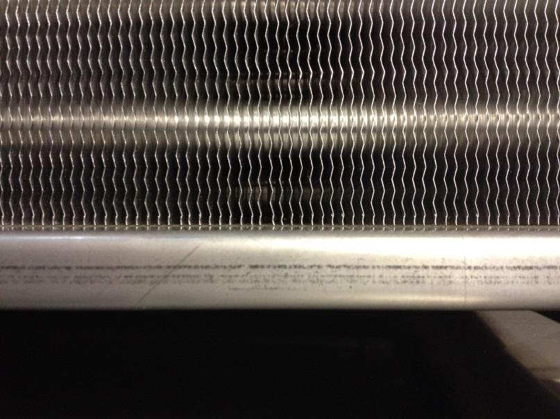 Gaps between fin-bundle and coil casing reduces