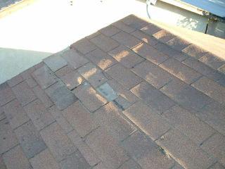 Page 1 of 9 Damaged roof shingles.