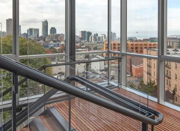 BUILDING FEATURES Living Building Challenge TM certified Abundant natural light with 14 floor-to-ceiling windows and open office layouts Large covered bike garage with a repair station, and