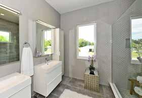tall storage cabinets next sinks Tile accent wall Large walk-in shower with