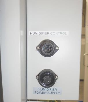 Mount the humidifier onto the side of the cabinet by sliding it into the bracket. Connect the 2 x vapor hoses between the fittings on top of the humidifier and those on the side of the cabinet.