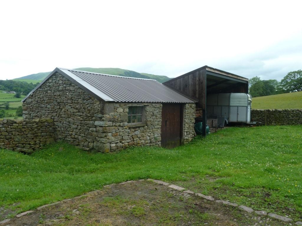 UNDER-HOUSED BYRE: 5.28m x 3.05m (17 4 x 11 5 ) Three stalls. Window to rear. Concrete and cobble floor.