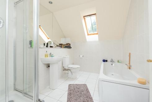 34m (7'8) White suite comprising panel bath with chrome mono mixer tap; tiled shower cubicle with