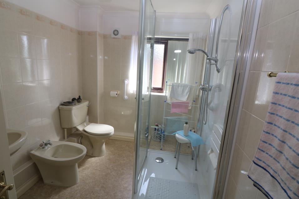 Bathroom measuring approximately 10 x 6 7 (3.05 x 2.01m) maximum, with panelled radiator, towel rail, ceramic tiled surrounds.