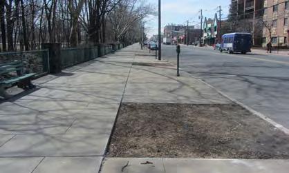 Empty tree pits cross the street could be plnted with trees nd retrofitted with stormwter storge cpcity underground.