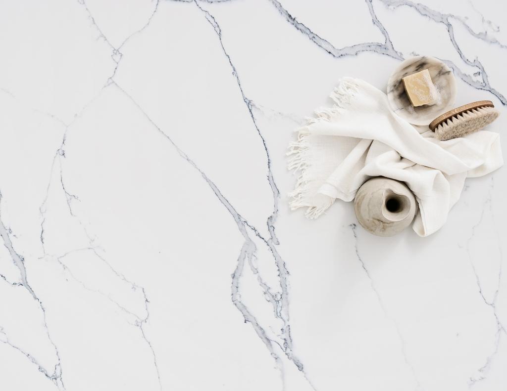 classic and strikingly modern. This page: Smartstone Statuario Venato was inspired by prestigious Statuario marble. Cover: Smartstone Petra Grigio replicates an Italian grey-brown marble.