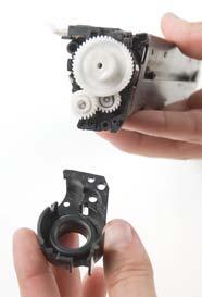 the toner hopper and the gear housing end cap (See photo 16).