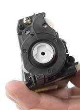 Place the gear housing end cap onto the toner hopper and install the screw that