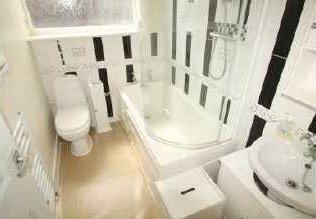 Bathroom Fitted with a three piece white suite with mains shower over the